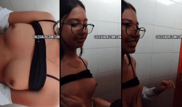 jovencita calenturienta enseñando las tetas en los baños del colegio